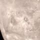 Illustration for article titled Charon Poses a Geomorphic Riddle: How do You Make a Mountain in a Moat?